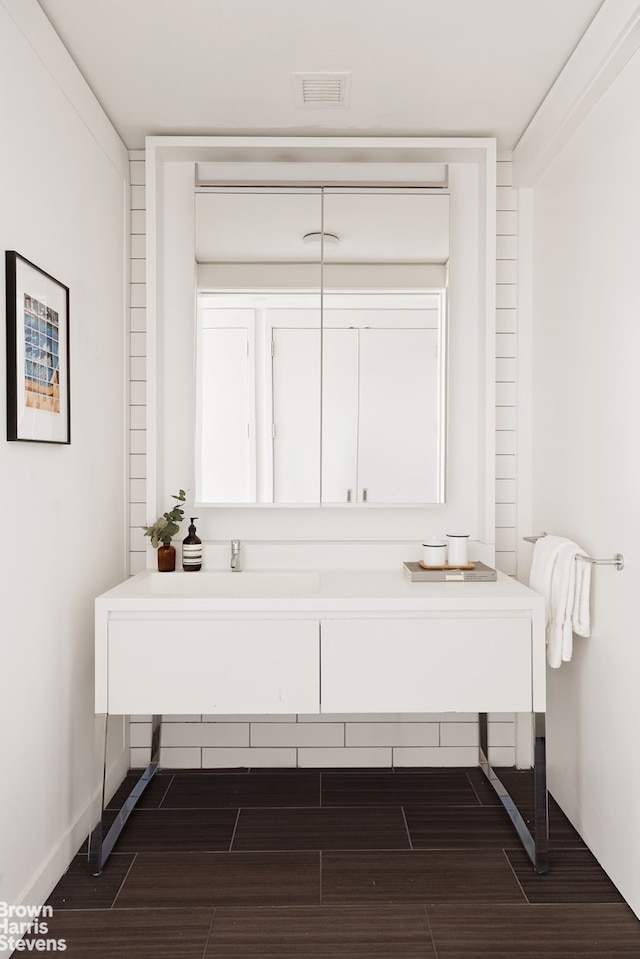 15 William St Unit 33I, New York City, NY 10004 - bathroom with wood finished floors and vanity
