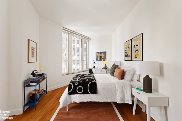 15 William St Unit 33I, New York City, NY 10004 - bedroom featuring wood finished floors and baseboards