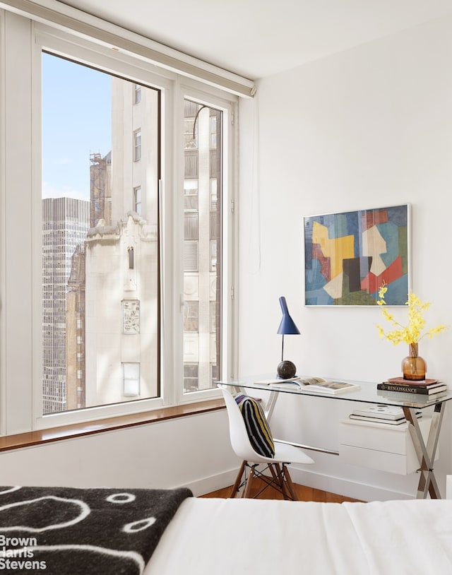 15 William St Unit 33I, New York City, NY 10004 - bedroom featuring wood finished floors and a desk