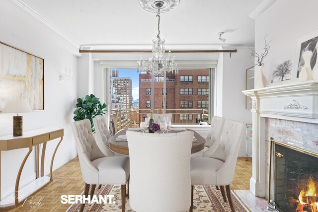 dining space featuring a high end fireplace, ornamental molding, a chandelier, and a view of city