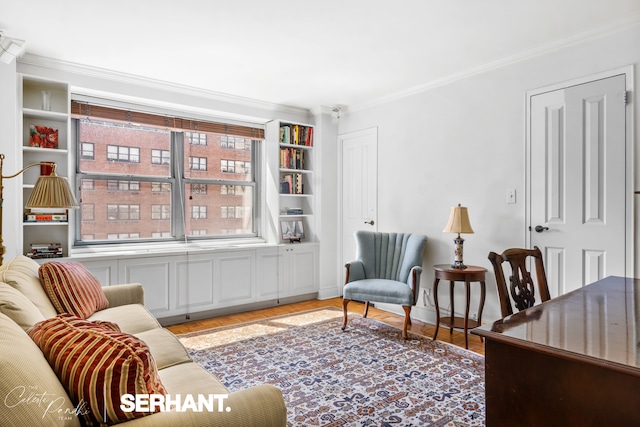 living area featuring crown molding and light wood-style floors