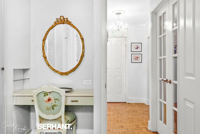 corridor with a chandelier
