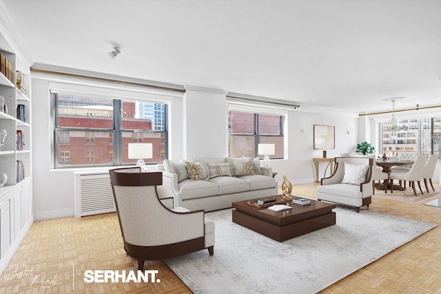 living room with crown molding, plenty of natural light, and baseboards