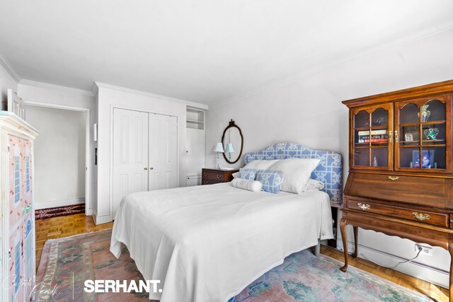 132 E 35th St Unit 16Gh, New York City, NY 10016 - bedroom featuring a closet, crown molding, and baseboards