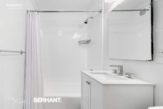 full bathroom featuring vanity and shower / bath combination with curtain