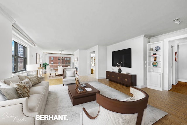 living area with crown molding and baseboards