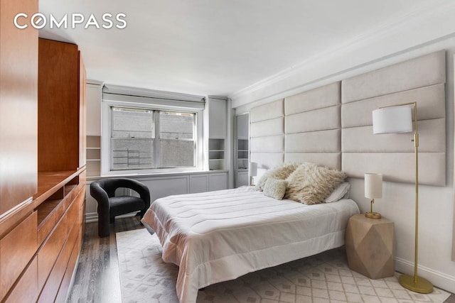 520 E 76th St Unit 11C, New York City, NY 10021 - bedroom with light wood-type flooring and baseboards