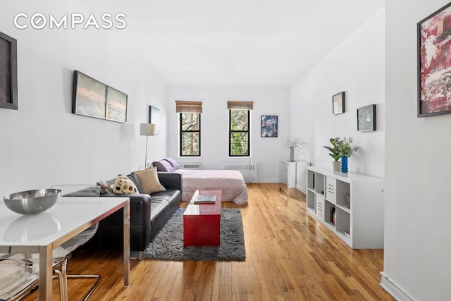 205 E 89th St Unit 4C, New York City, NY 10128 - bedroom with radiator and wood finished floors
