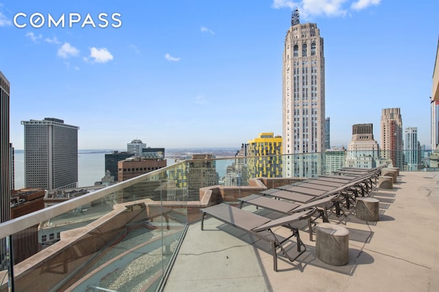75 Wall St Unit 24M, New York City, NY 10005 - view of patio featuring a skyline view and a water view