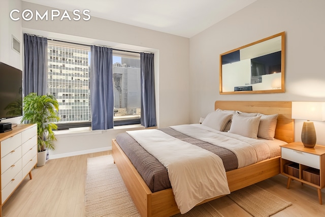 75 Wall St Unit 24M, New York City, NY 10005 - bedroom with light wood finished floors
