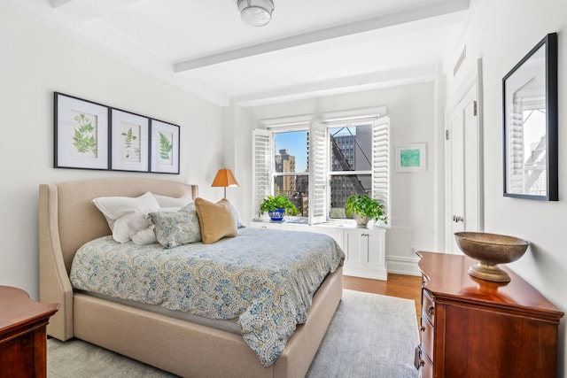 215 W 88th St Unit 11Ab, New York City, NY 10024 - bedroom with beamed ceiling and wood finished floors