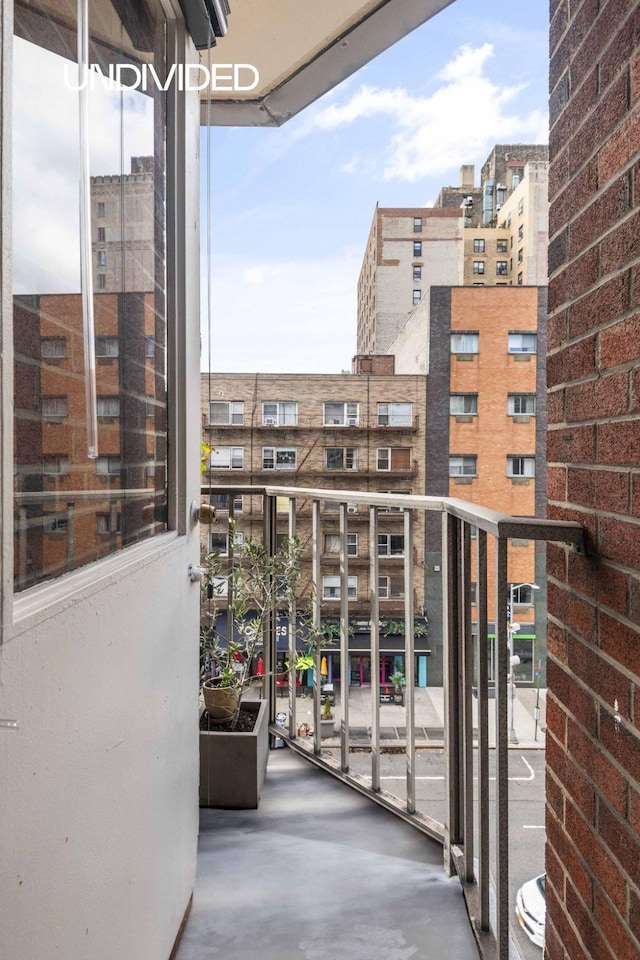 balcony featuring a view of city