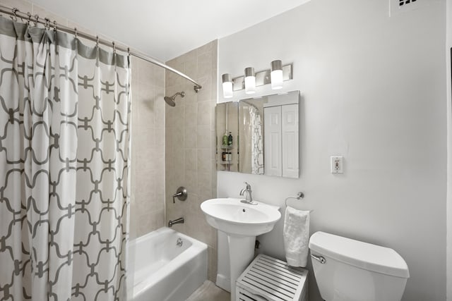 full bath with shower / bath combo and toilet