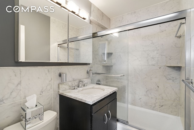 401 E 86th St Unit 15C, New York City, NY 10028 - full bath with vanity, enclosed tub / shower combo, and tile walls
