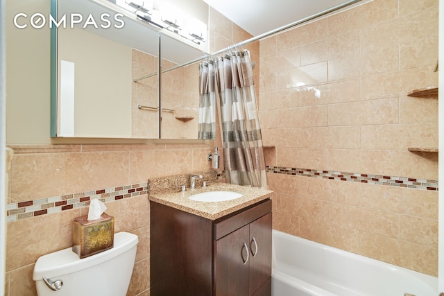 401 E 86th St Unit 15C, New York City, NY 10028 - bathroom featuring tile walls, vanity, and shower / bathtub combination with curtain