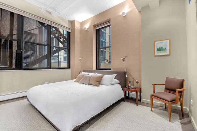 bedroom with baseboards and a baseboard radiator