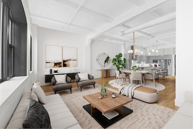 9 W 20th St Unit 2, New York City, NY 10011 - living area featuring light wood finished floors, a chandelier, and beamed ceiling