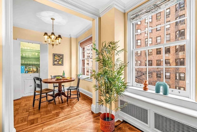14 Sutton Pl S Unit 4C, New York City, NY 10022 - dining space with ornamental molding, a chandelier, and radiator heating unit