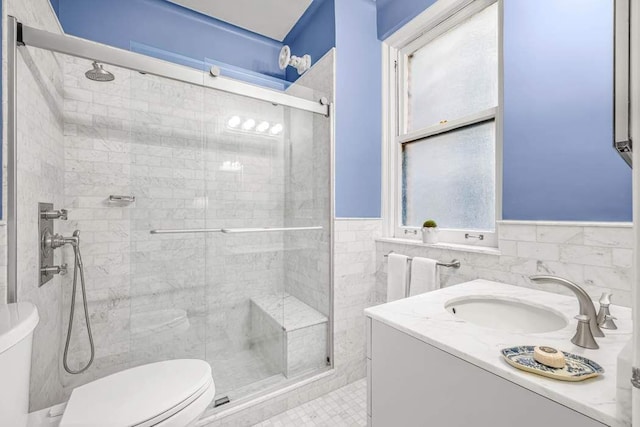 14 Sutton Pl S Unit 4C, New York City, NY 10022 - full bathroom featuring a stall shower, radiator heating unit, tile walls, vanity, and wainscoting