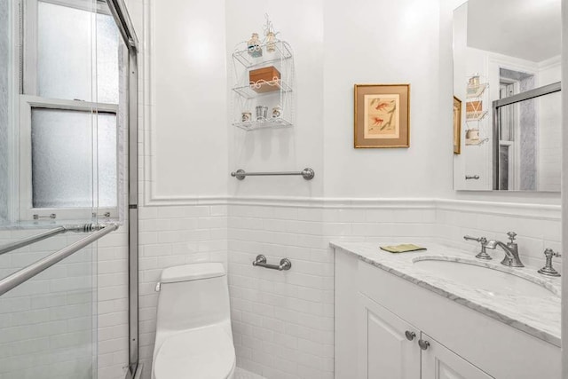 14 Sutton Pl S Unit 4C, New York City, NY 10022 - full bath with tile walls, vanity, wainscoting, and a stall shower