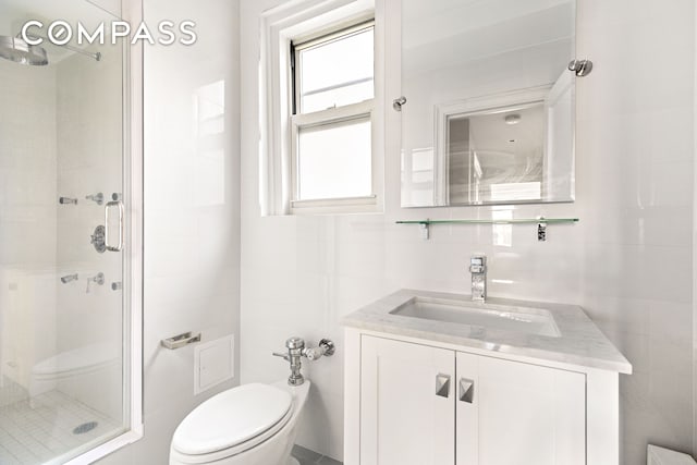 434 E 52nd St Unit 10E, New York City, NY 10022 - full bath with a shower stall, toilet, vanity, and tile walls