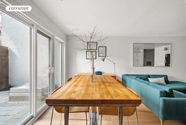 dining area with recessed lighting, visible vents, light wood-type flooring, and a wealth of natural light