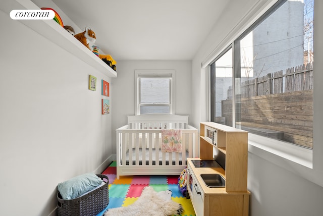 bedroom featuring a crib