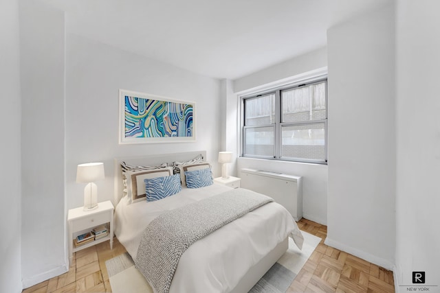 330 E 49th St Unit 2-A, New York City, NY 10017 - bedroom featuring baseboards