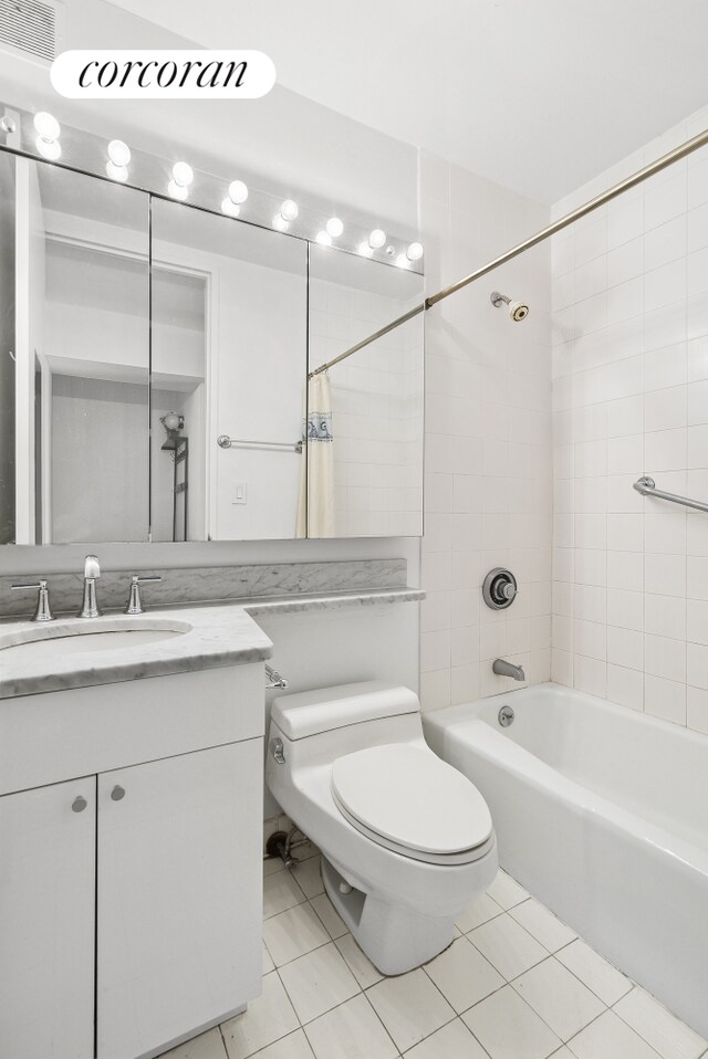 393 W 49th St Unit 3M, New York City, NY 10019 - full bath featuring tile patterned flooring, shower / bathtub combination with curtain, vanity, and toilet