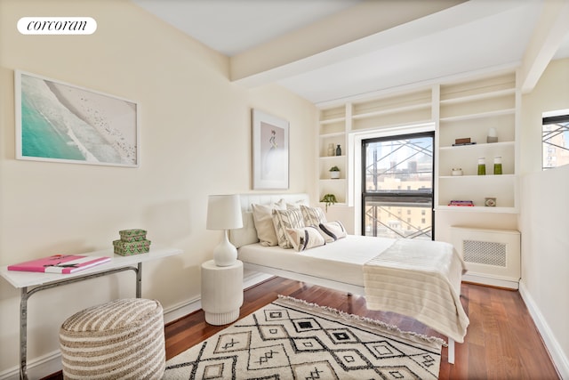 150 Joralemon St Unit 11D, New York City, NY 11201 - bedroom with wood finished floors, baseboards, and beamed ceiling