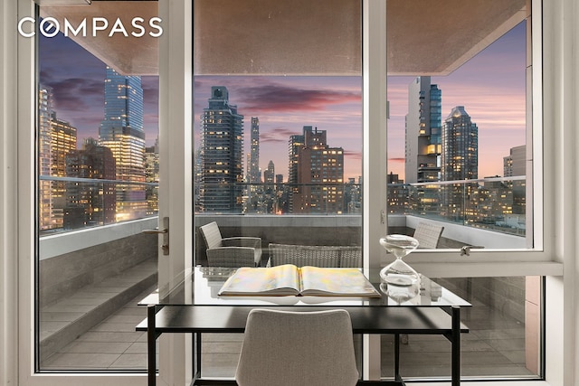 301 E 61st St Unit 16A, New York City, NY 10065 - dining room with a skyline view and plenty of natural light