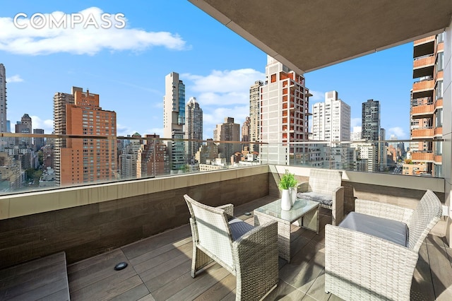 301 E 61st St Unit 16A, New York City, NY 10065 - balcony featuring a view of skyline