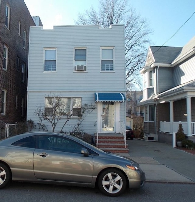 view of front of property featuring cooling unit