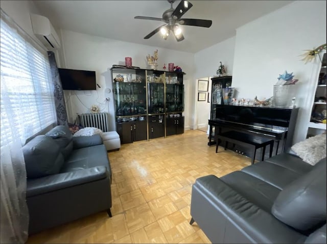 living room featuring a ceiling fan, a wall unit AC, and radiator