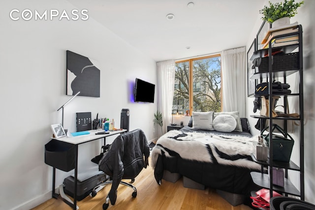 42 Rochester Ave Unit 3, New York City, NY 11233 - bedroom featuring wood finished floors and a desk