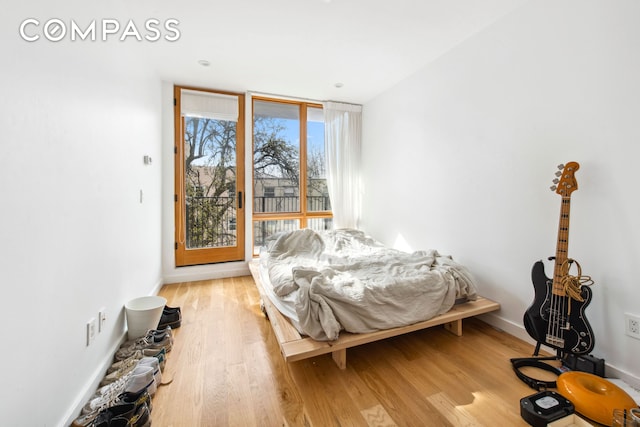 42 Rochester Ave Unit 3, New York City, NY 11233 - bedroom featuring light wood-type flooring and baseboards
