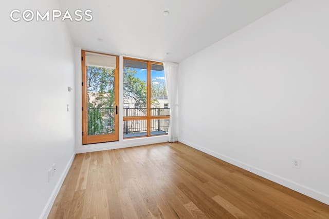 42 Rochester Ave Unit 3, New York City, NY 11233 - empty room featuring baseboards and light wood-style flooring