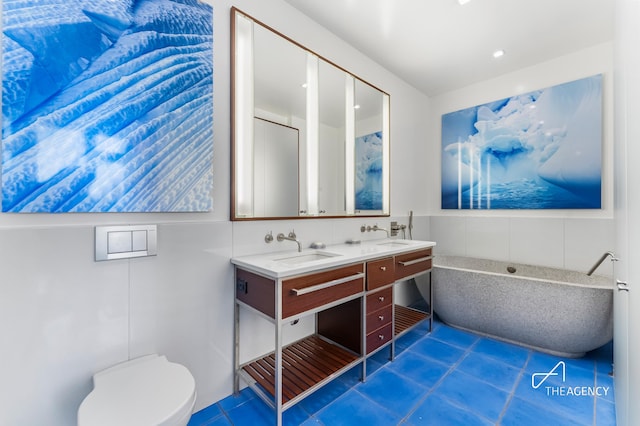 200 11th Ave Unit 7S, New York City, NY 10011 - full bath featuring tile patterned flooring, toilet, and double vanity