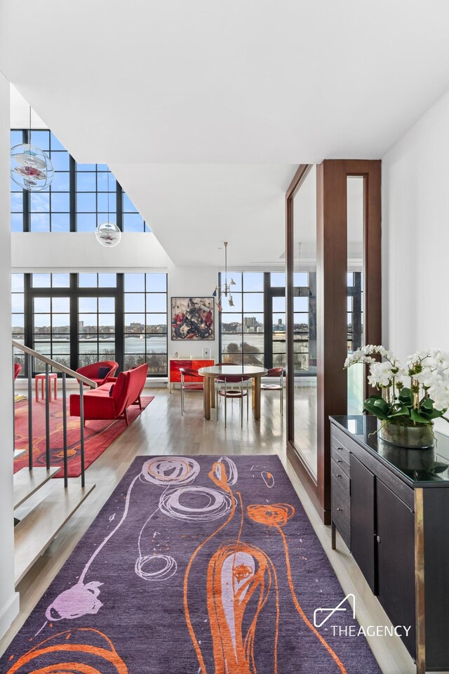 200 11th Ave Unit 7S, New York City, NY 10011 - living area with plenty of natural light, wood finished floors, and floor to ceiling windows
