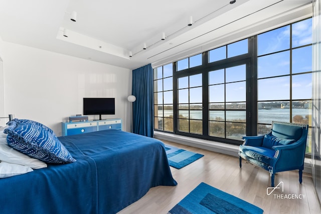 200 11th Ave Unit 7S, New York City, NY 10011 - bedroom featuring wood finished floors