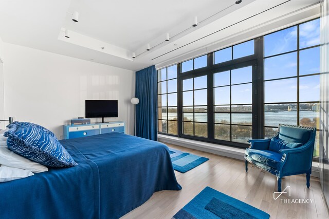 200 11th Ave Unit 7S, New York City, NY 10011 - bedroom featuring wood finished floors