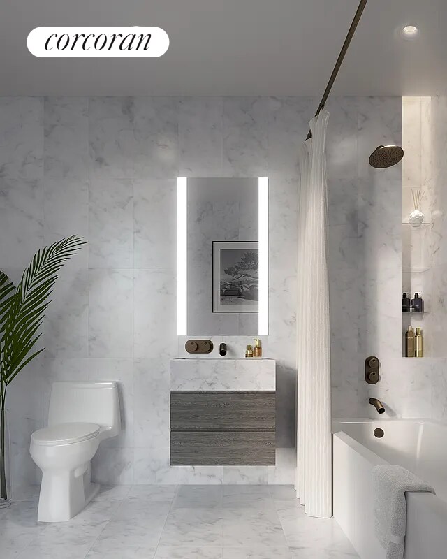 130 William St Unit 64B, New York City, NY 10038 - bathroom featuring marble finish floors, vanity, and tile walls