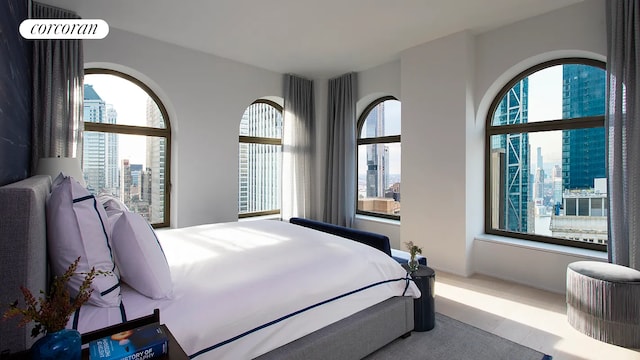 bedroom with a view of city