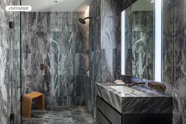 130 William St Unit 43C, New York City, NY 10038 - bathroom with tile walls, marble tiled floors, vanity, and a marble finish shower