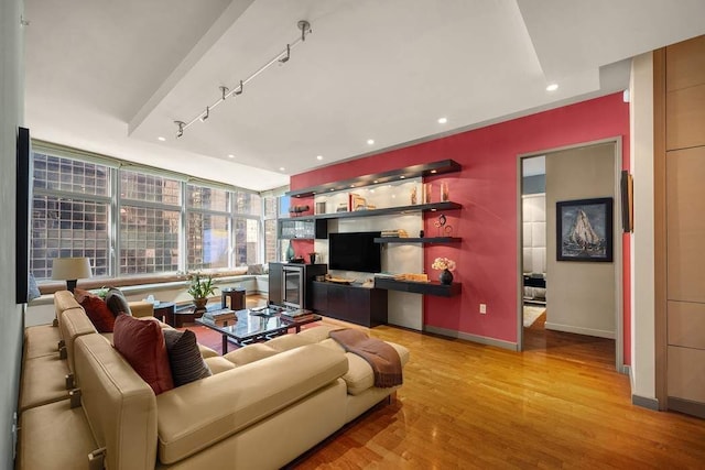 1600 Broadway Unit 18C, New York City, NY 10019 - living area with wood finished floors, rail lighting, baseboards, and recessed lighting