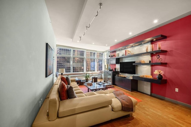 1600 Broadway Unit 18C, New York City, NY 10019 - living room with track lighting, wood finished floors, baseboards, recessed lighting, and a dry bar