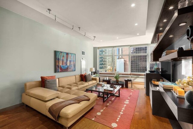 1600 Broadway Unit 18C, New York City, NY 10019 - living room featuring wood finished floors, recessed lighting, baseboards, and rail lighting