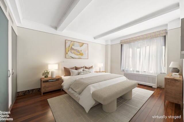 345 E 57th St Unit 8Ab, New York City, NY 10022 - bedroom with radiator, dark wood finished floors, and beamed ceiling
