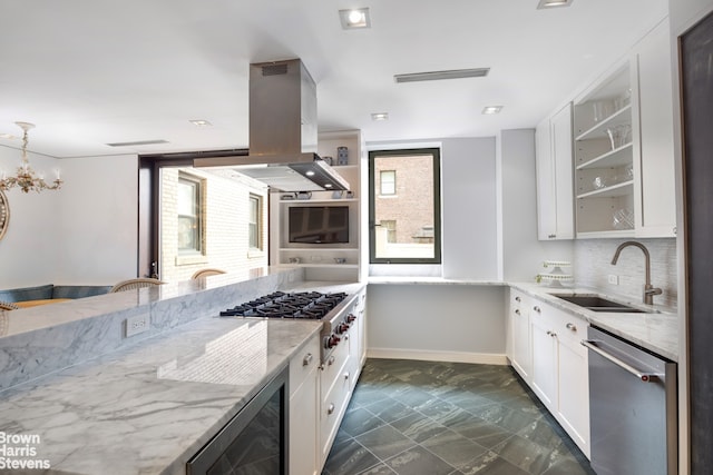 345 E 57th St Unit 8Ab, New York City, NY 10022 - kitchen featuring appliances with stainless steel finishes, a sink, beverage cooler, island exhaust hood, and light stone counters