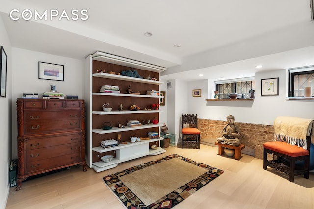living area featuring wood finished floors and recessed lighting